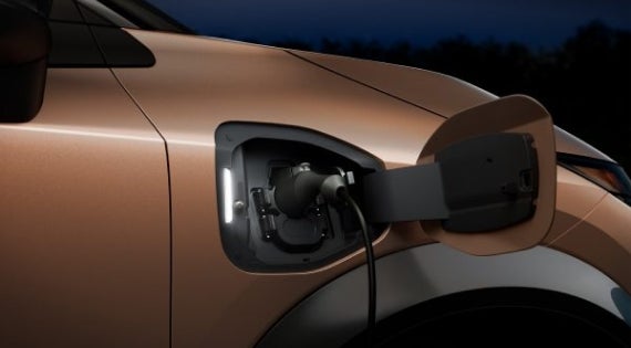 Close-up image of charging cable plugged in | Mankato Nissan in Mankato MN